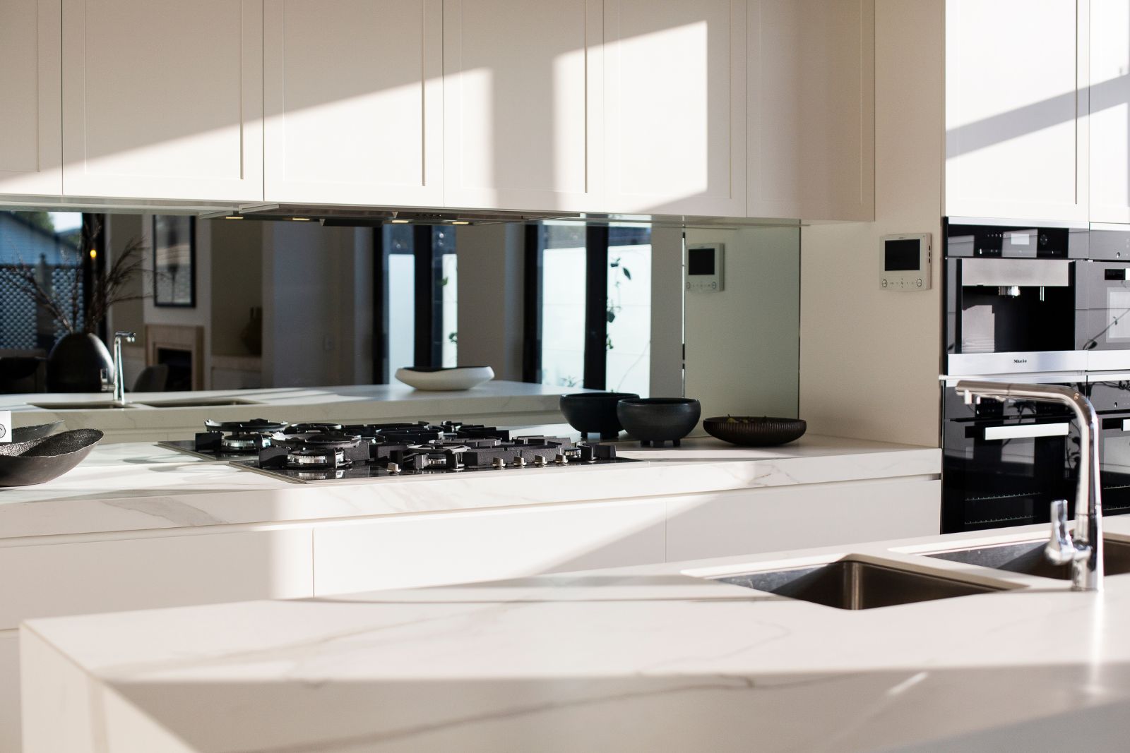 all-white marble kitchen